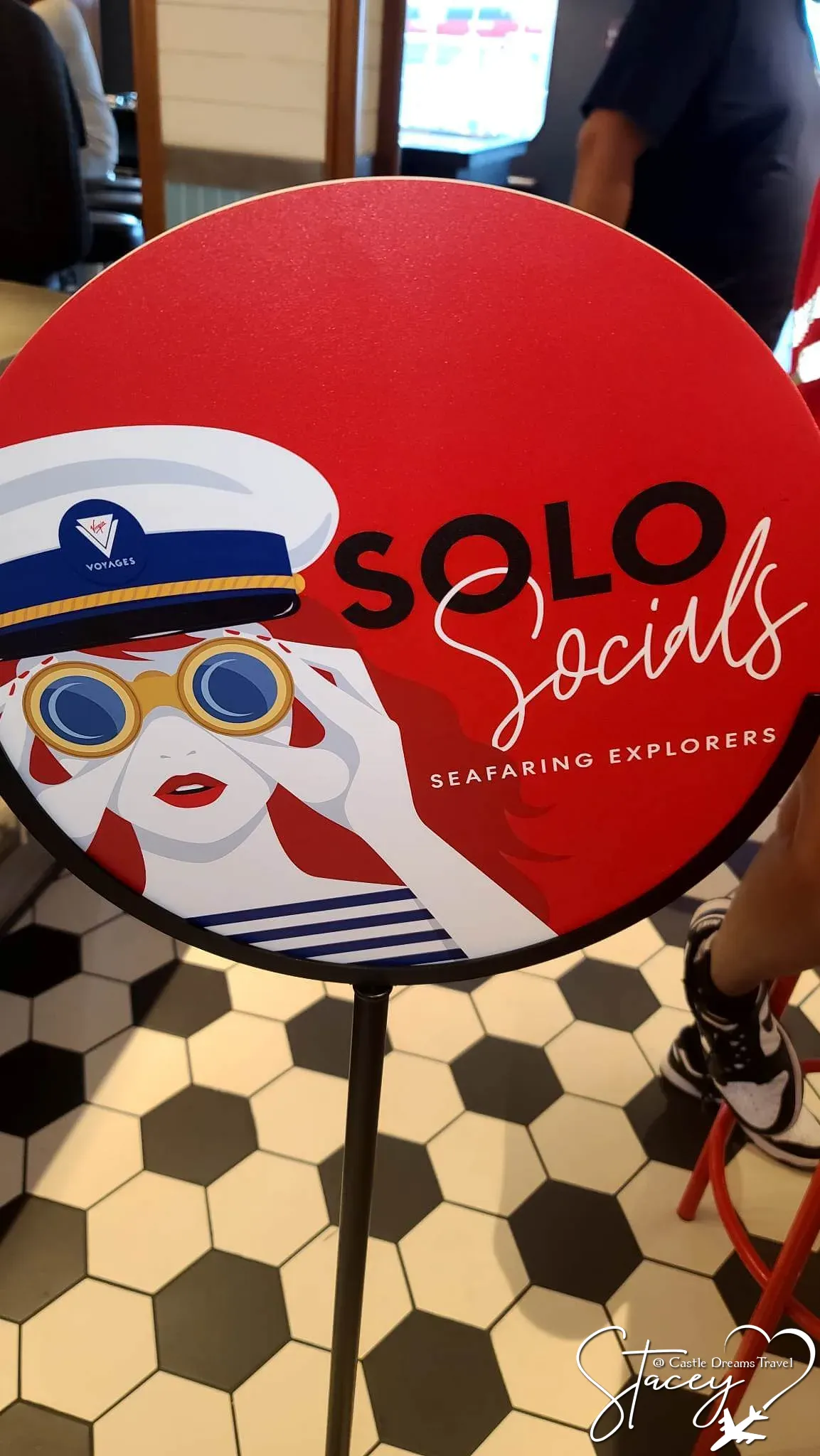 Solo Socials — Seafaring Explorers event sign aboard a Virgin Voyages ship