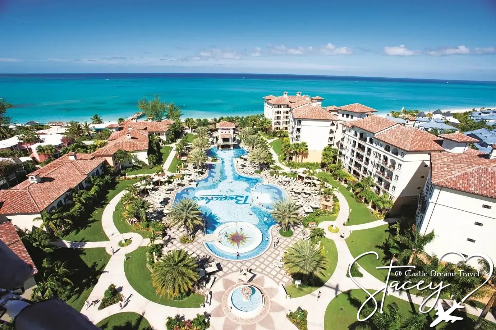 Aerial view of a family-friendly Beaches all-inclusive resort with pools beside a turquoise ocean