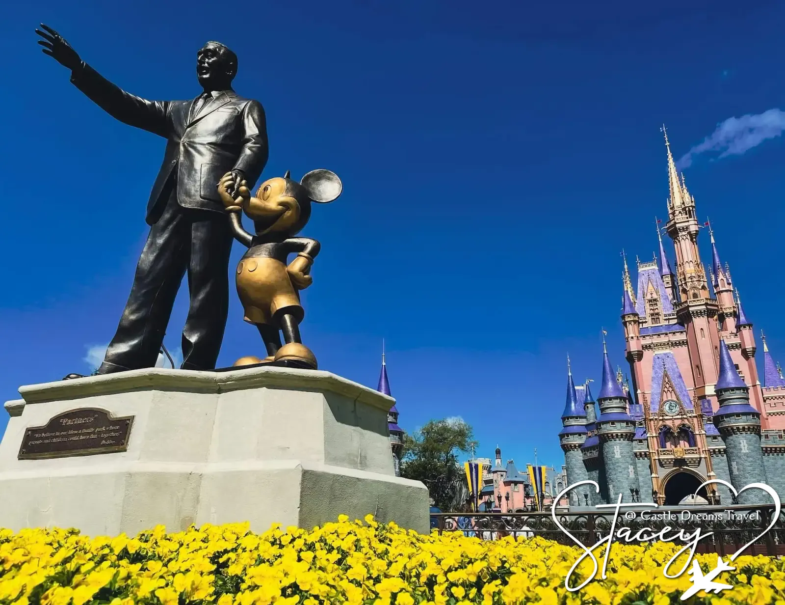 The Partners statue of Walt Disney and Mickey Mouse in front of Cinderella Castle at Magic Kingdom