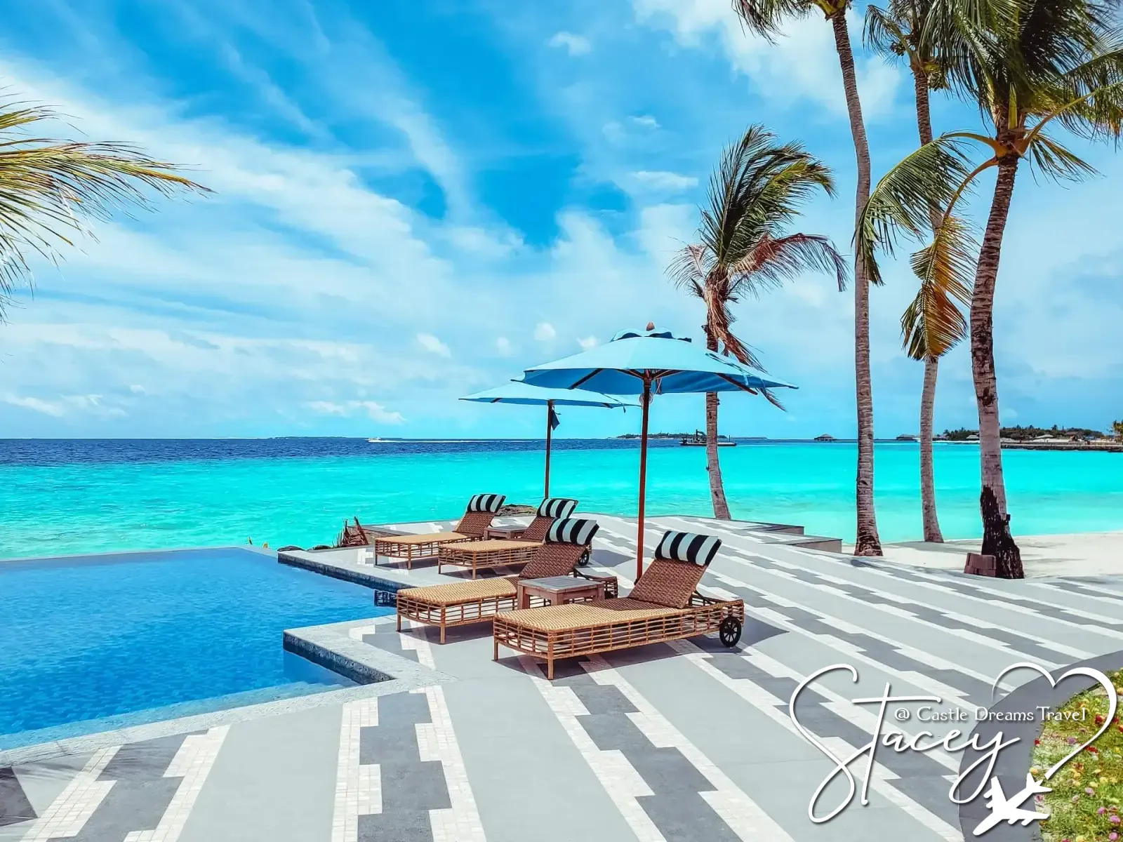 Overwater bungalows on a turquoise tropical lagoon