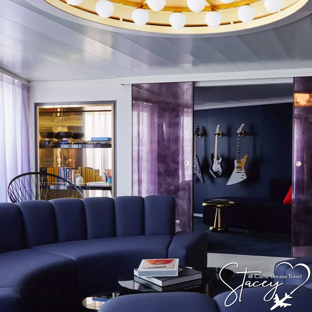 RockStar suite lounge aboard a Virgin Voyages ship, with guitars on the wall