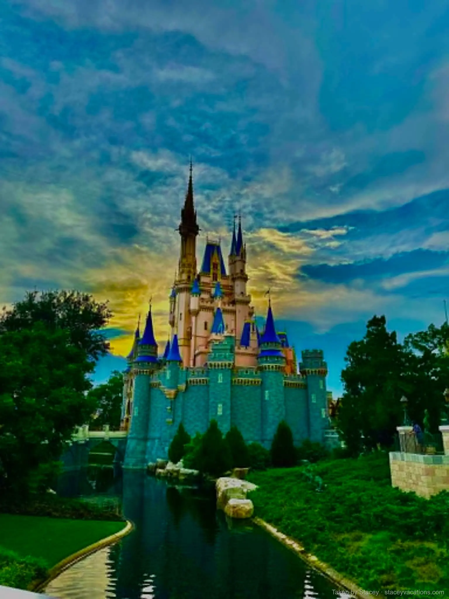 Cinderella Castle at sunset across the moat at Magic Kingdom — photo by Stacey