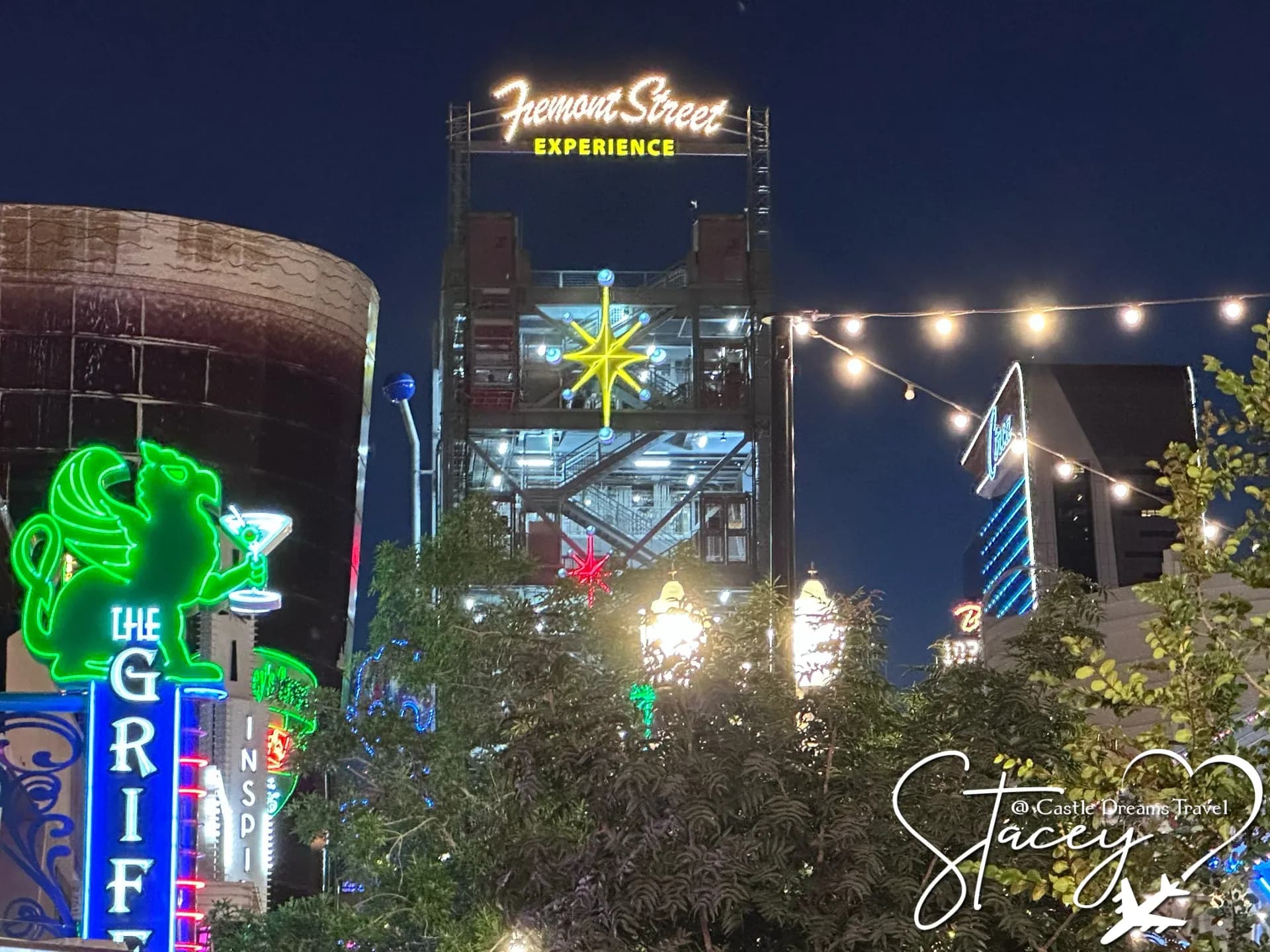 The Fremont Street Experience sign lit against the evening sky in downtown Las Vegas