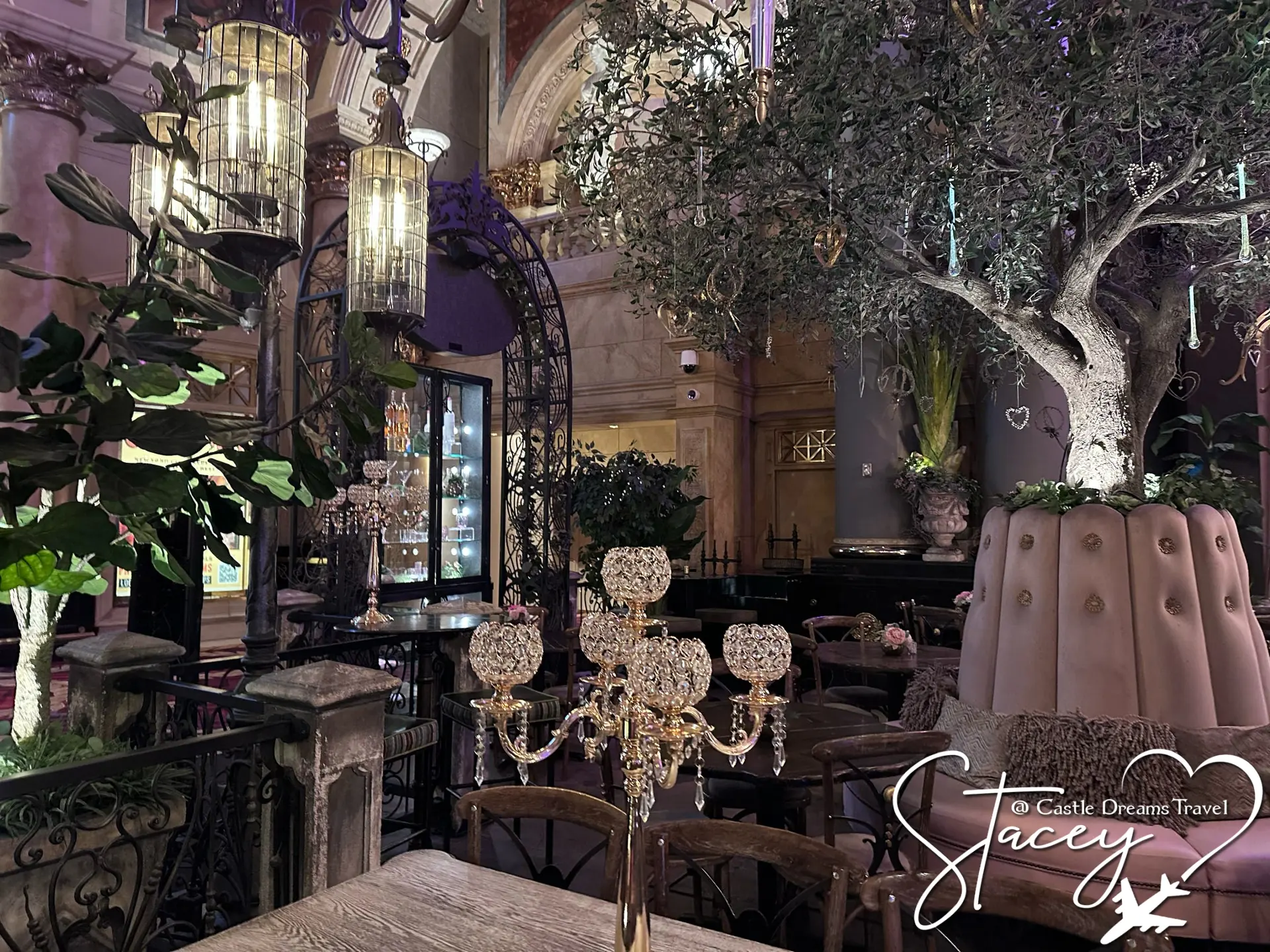 The Vanderpump Cocktail Garden interior — olive trees, crystal chandeliers and pink velvet seating