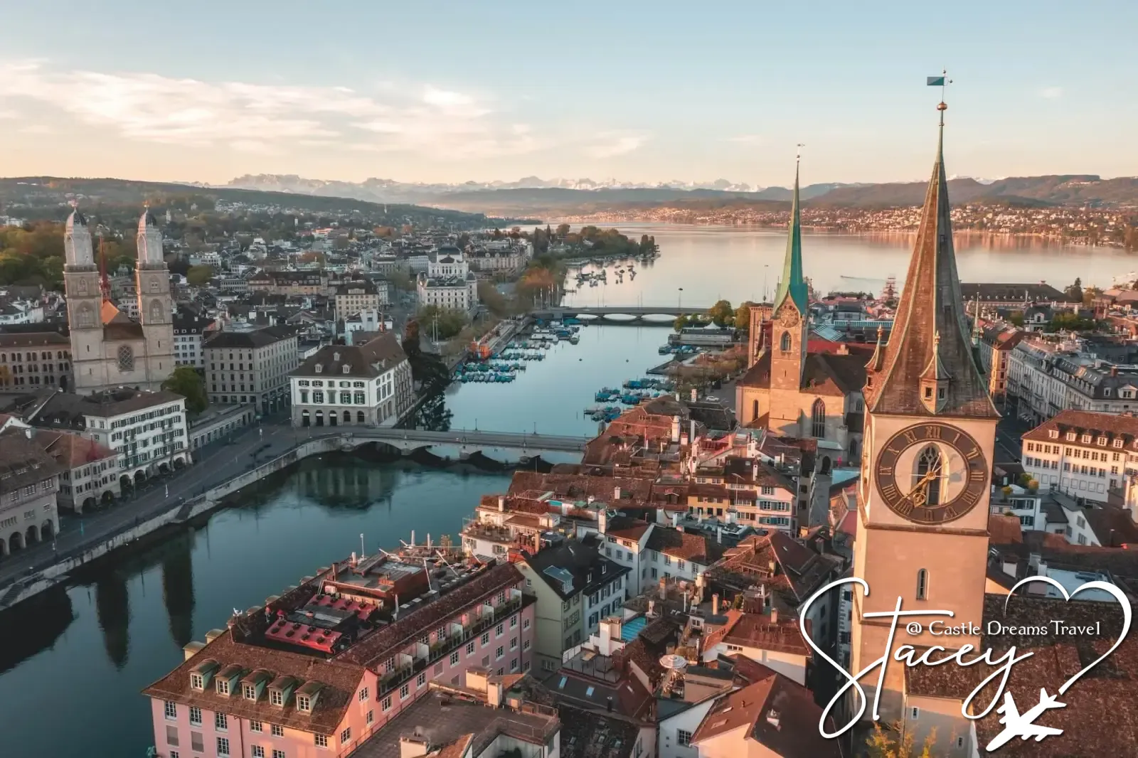 Zurich's old town along the Limmat River with the Alps beyond