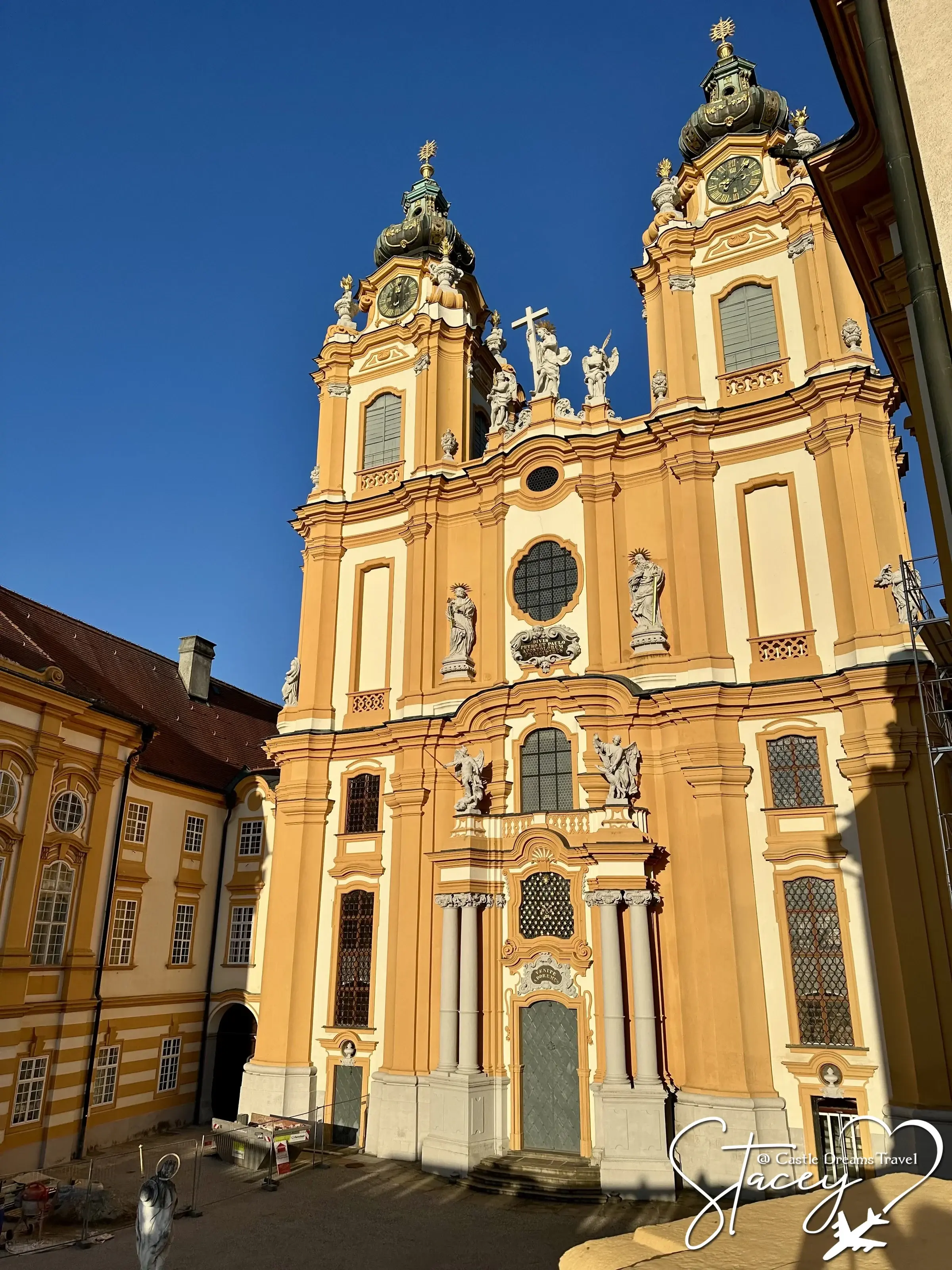 The twin Baroque bell towers of Melk Abbey's church against a clear blue sky, Wachau Valley, Austria