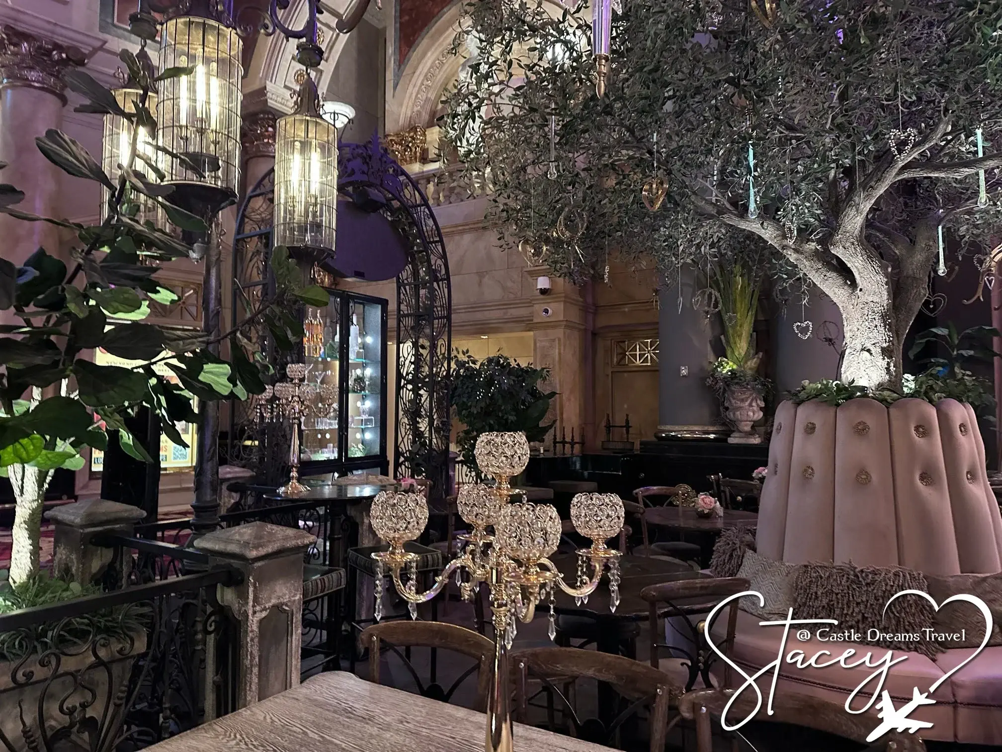 Chandeliers and olive trees inside a Las Vegas cocktail garden
